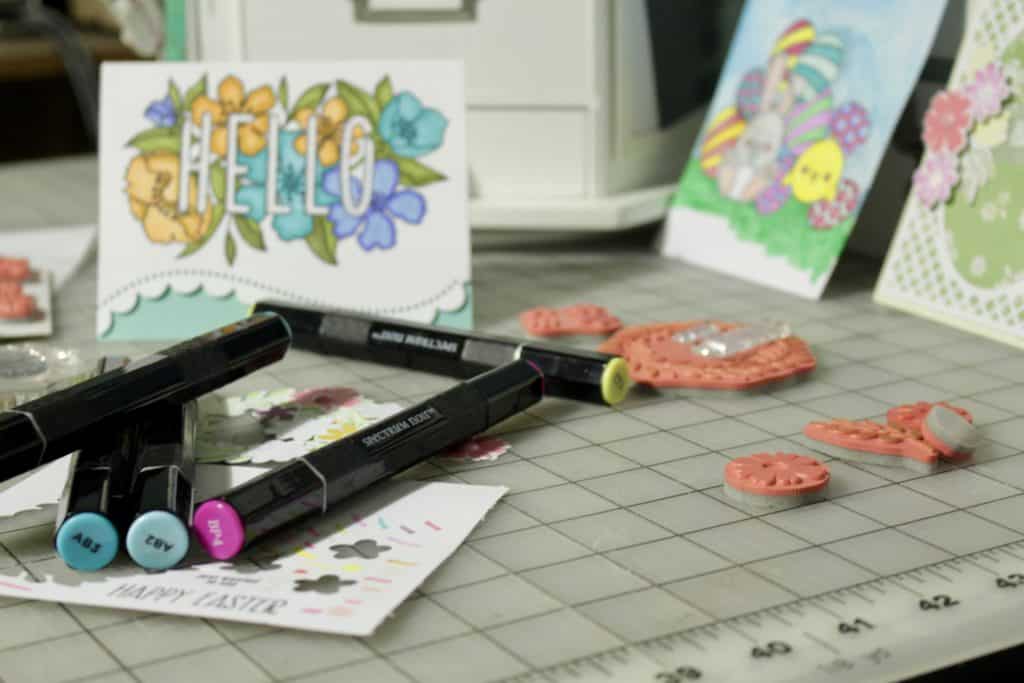 Markers and greeting cards on a table.