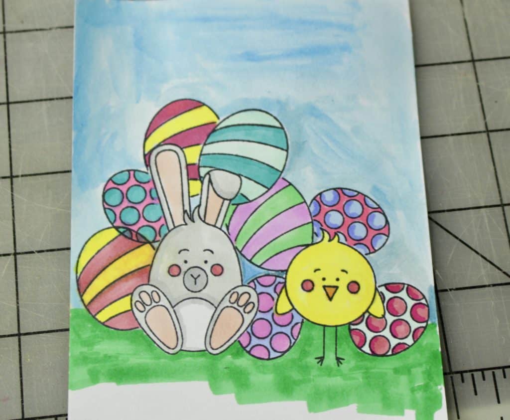 A bunny and chick with Easter eggs greeting card.