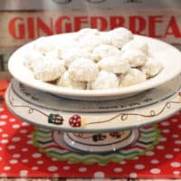 A plate of cookies on cake stand.