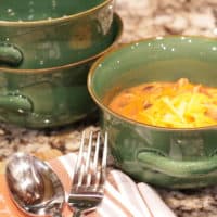 Instant Pot chicken chili bowls with a fork and spoon.