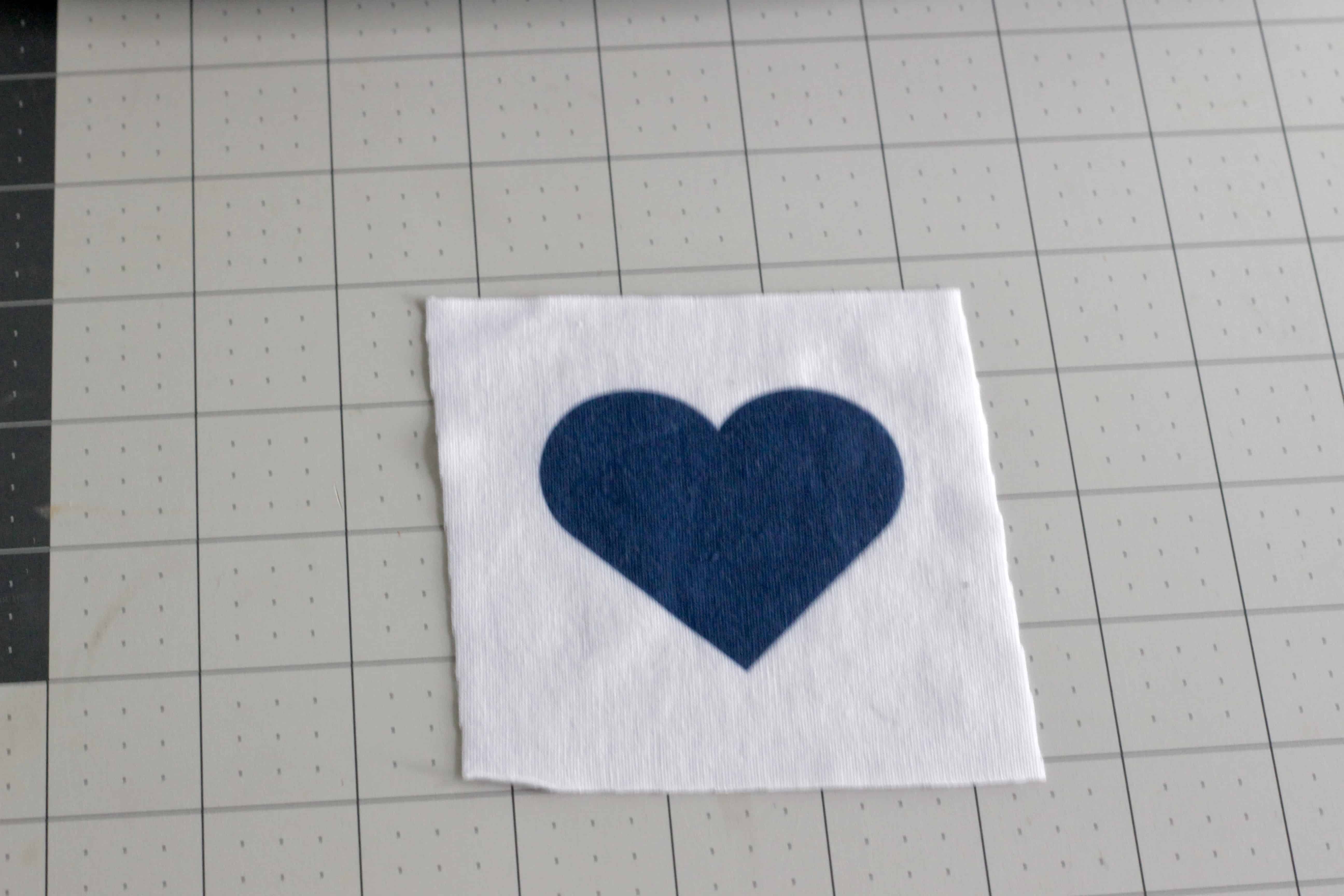 A heart transfer on a fabric square.