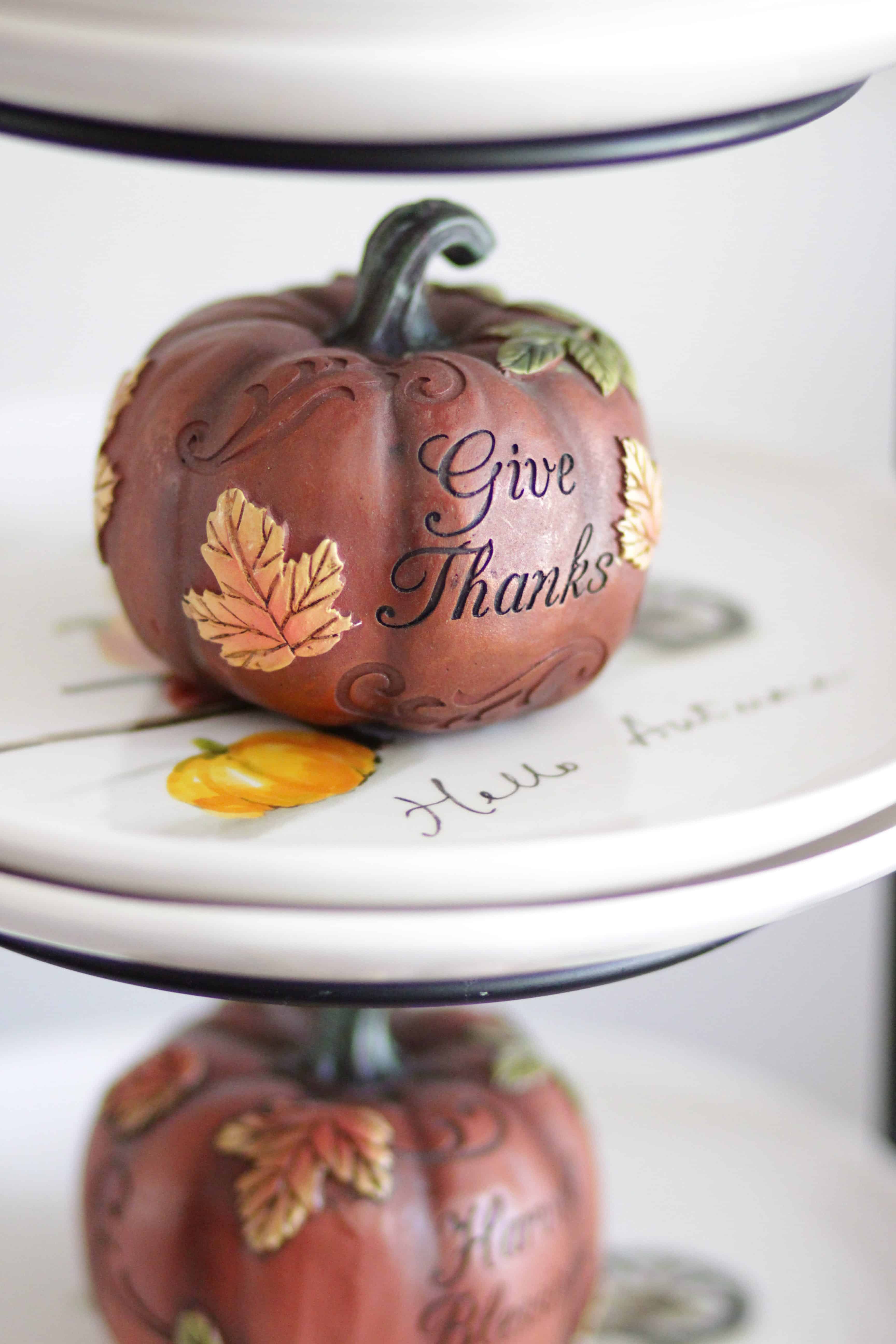 A closeup of an ornate pumpkin on a plate.