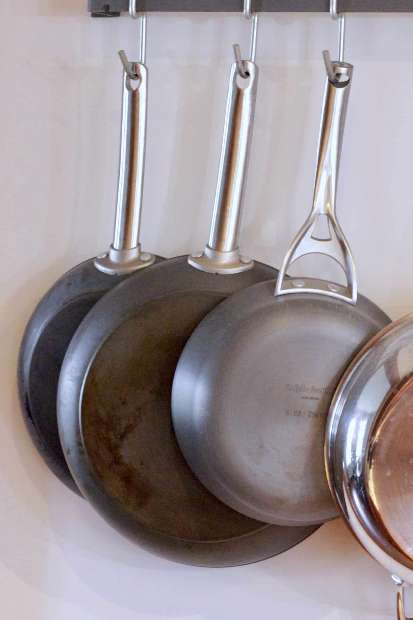 Pans hanging on wall.