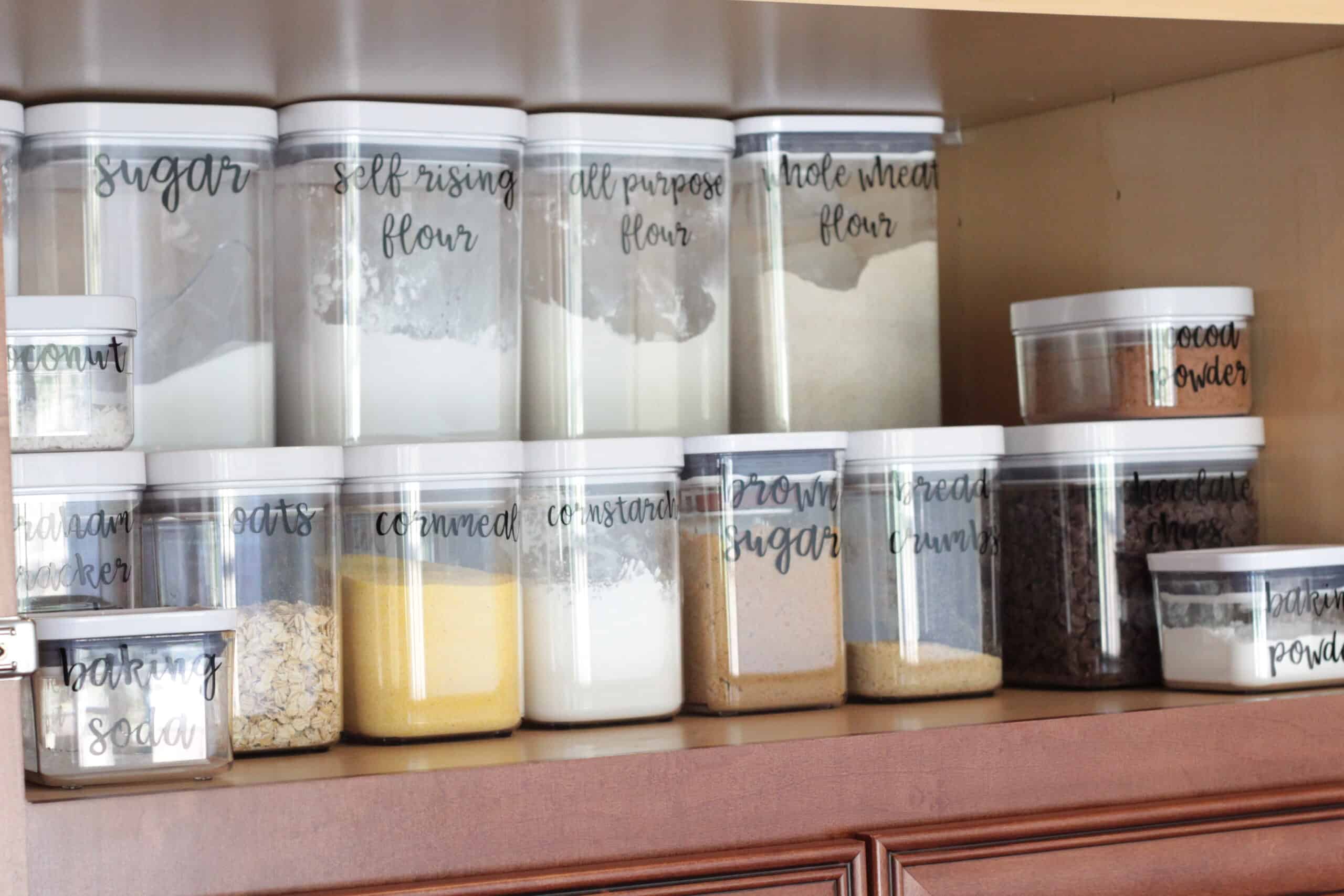 OXO containers labeled and full of pantry stable food.