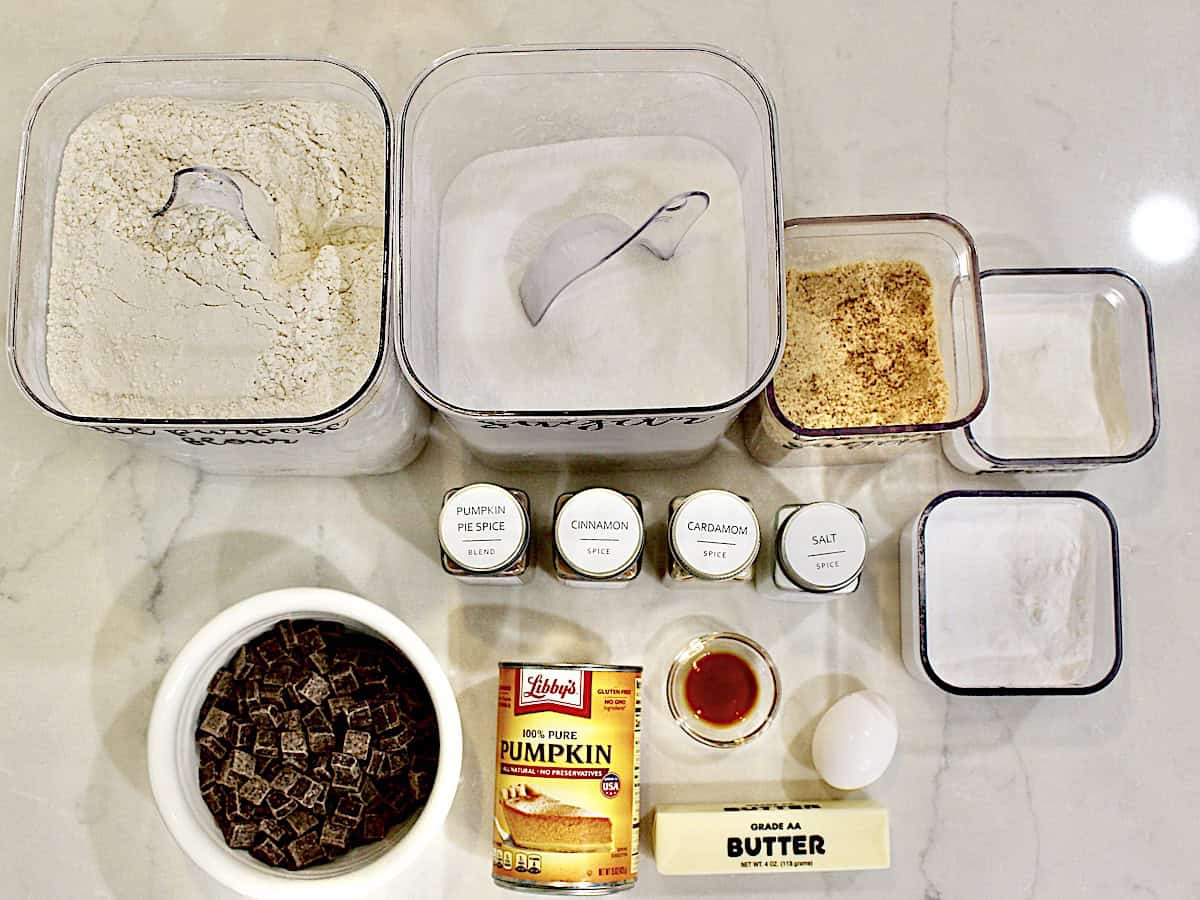 Various baking ingredients to make pumpkin chocolate chunk cookies.